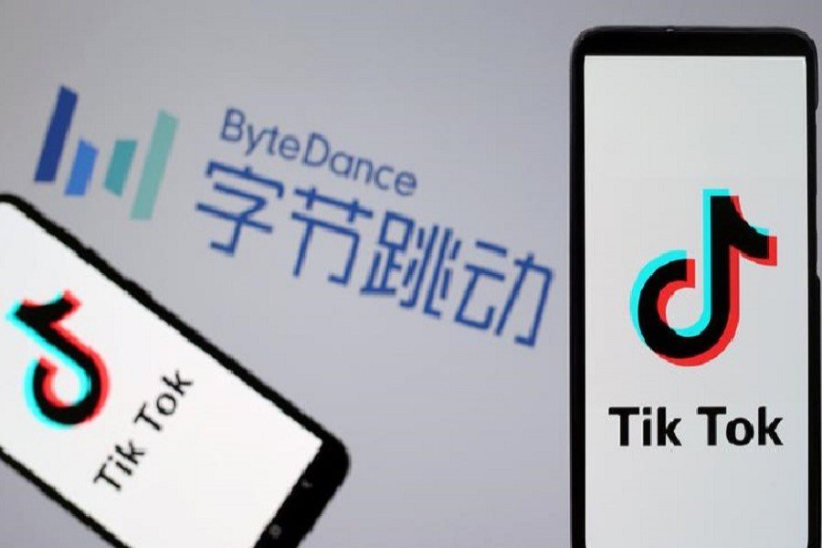 FILE PHOTO: TikTok logos are seen on smartphones in front of a displayed ByteDance logo in this illustration taken Nov. 27, 2019. 