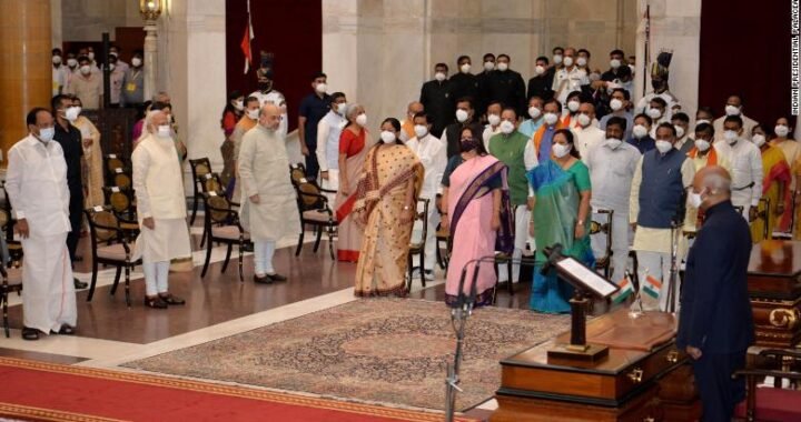 Newly sworn in ministers, right, stand with Prime Minister Narendra Modi, third left in front row, and other senior ministers during the swearing in ceremony at the Presidential Palace in New Delhi on July 7.